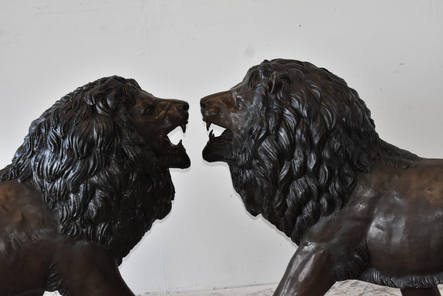 A Pair of Large Lions Walking Side by Side Bronze Statues Size: 24" x 60" x 41"H