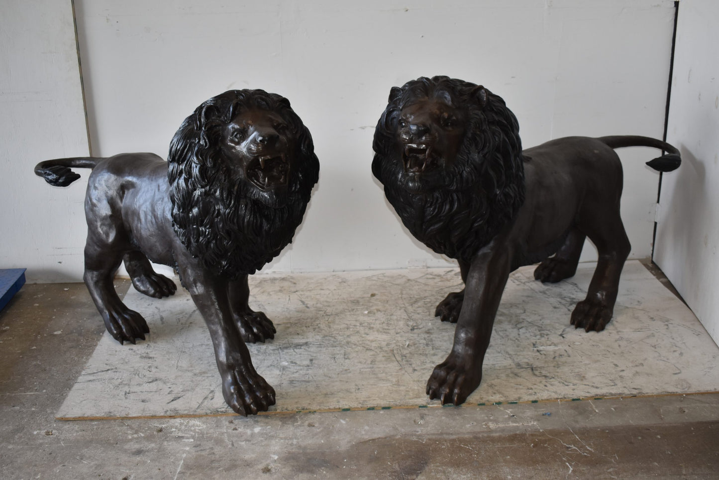 A Pair of Large Lions Walking Side by Side Bronze Statues Size: 24" x 60" x 41"H