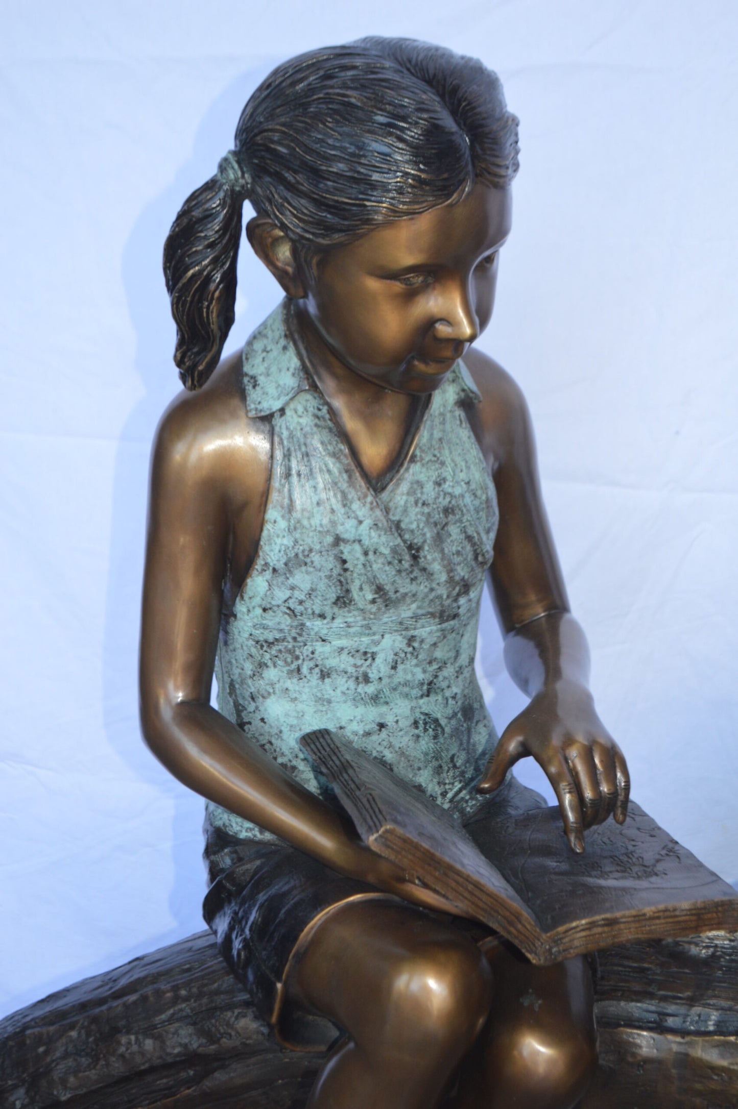 Two Kids on a tree log reading Bronze Statue Large -  Size: 44"L x 17"W x 42"H.