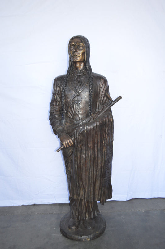 Indian Holding a Pipe Bronze Statue Life Size - Size: 26"L x 14"W x 68"H.