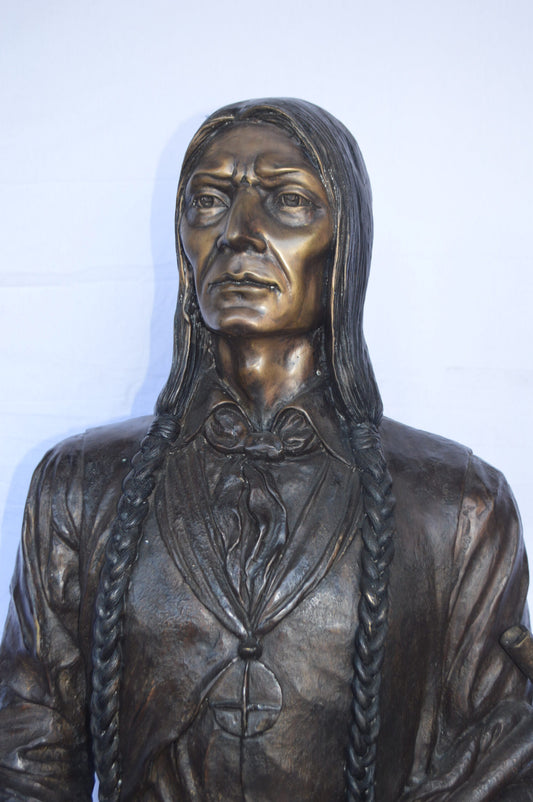 Indian Holding a Pipe Bronze Statue Life Size - Size: 26"L x 14"W x 68"H.