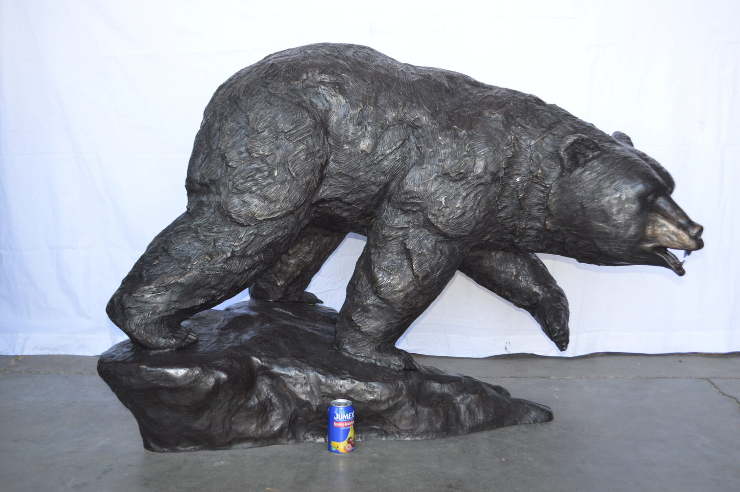 Wild Bear Walking on The Rocks Bronze Statue - Size: 58"L x 27"W x 40"H.