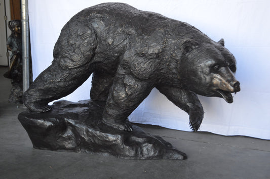 Wild Bear Walking on The Rocks Bronze Statue -  Size: 58"L x 27"W x 40"H.