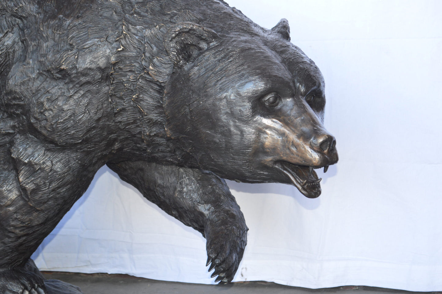 Wild Bear Walking on The Rocks Bronze Statue -  Size: 58"L x 27"W x 40"H.