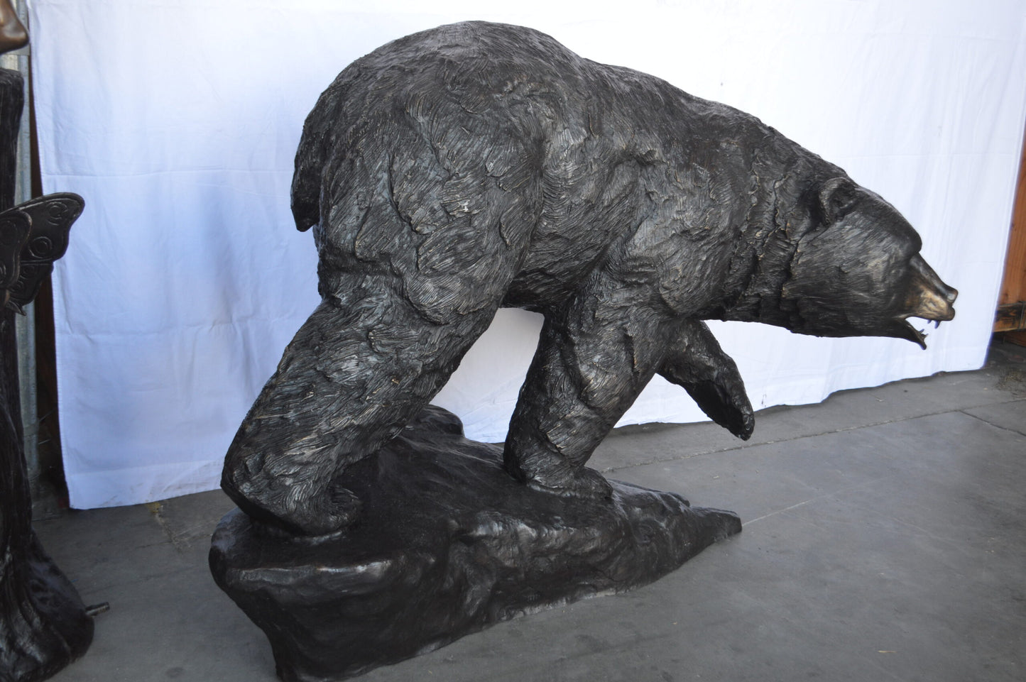 Wild Bear Walking on The Rocks Bronze Statue -  Size: 58"L x 27"W x 40"H.