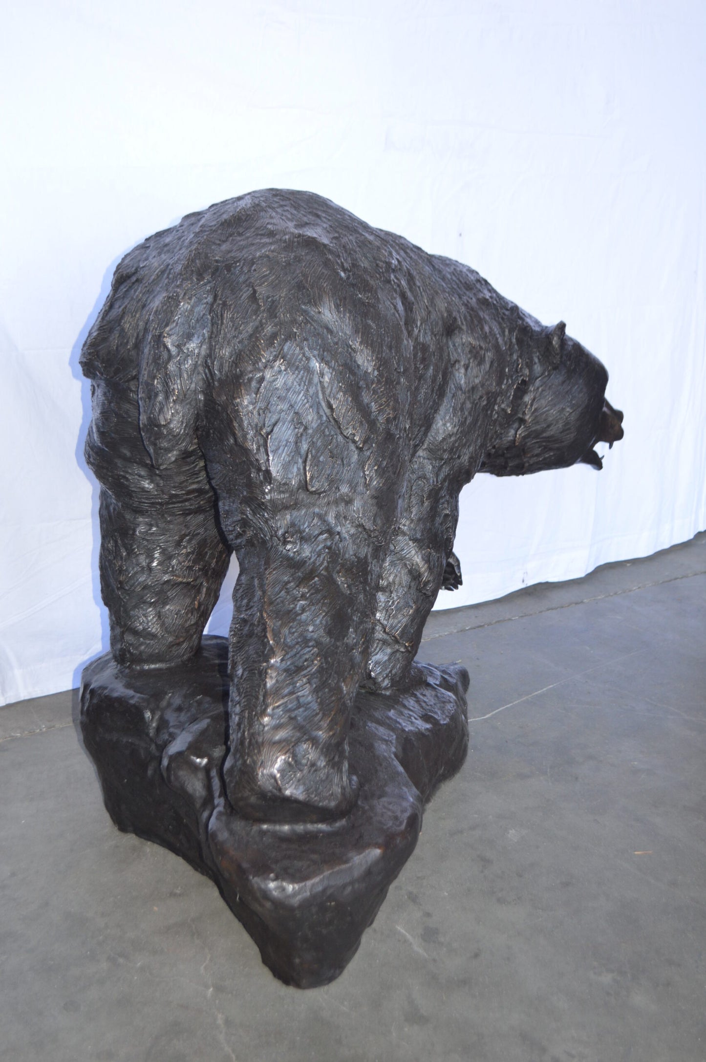 Wild Bear Walking on The Rocks Bronze Statue - Size: 58"L x 27"W x 40"H.