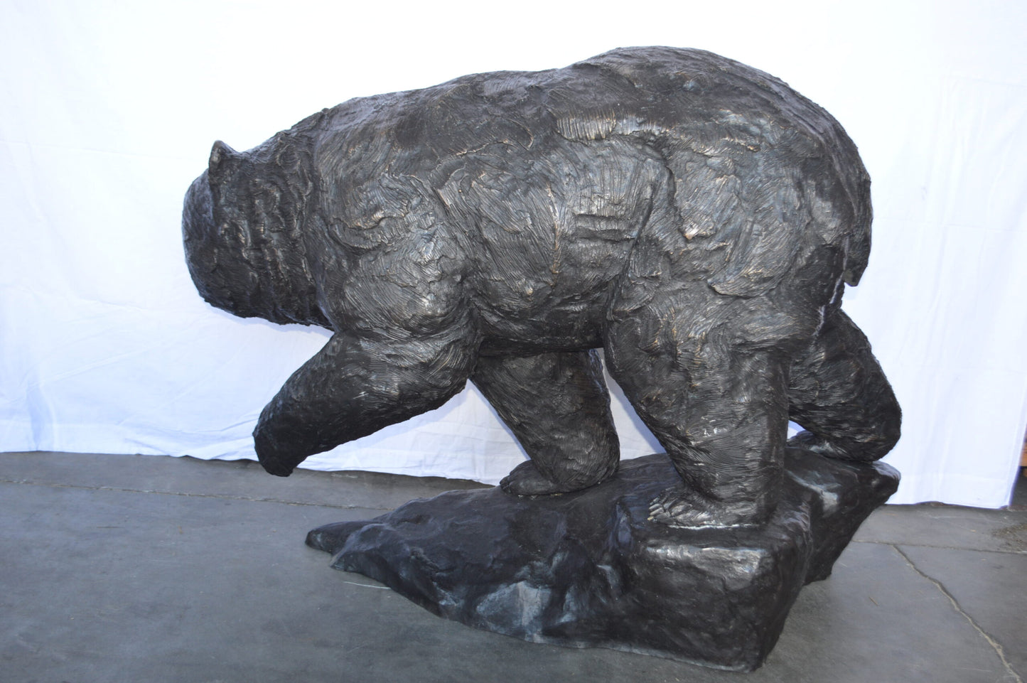Wild Bear Walking on The Rocks Bronze Statue -  Size: 58"L x 27"W x 40"H.
