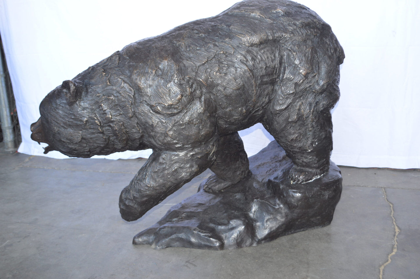 Wild Bear Walking on The Rocks Bronze Statue -  Size: 58"L x 27"W x 40"H.