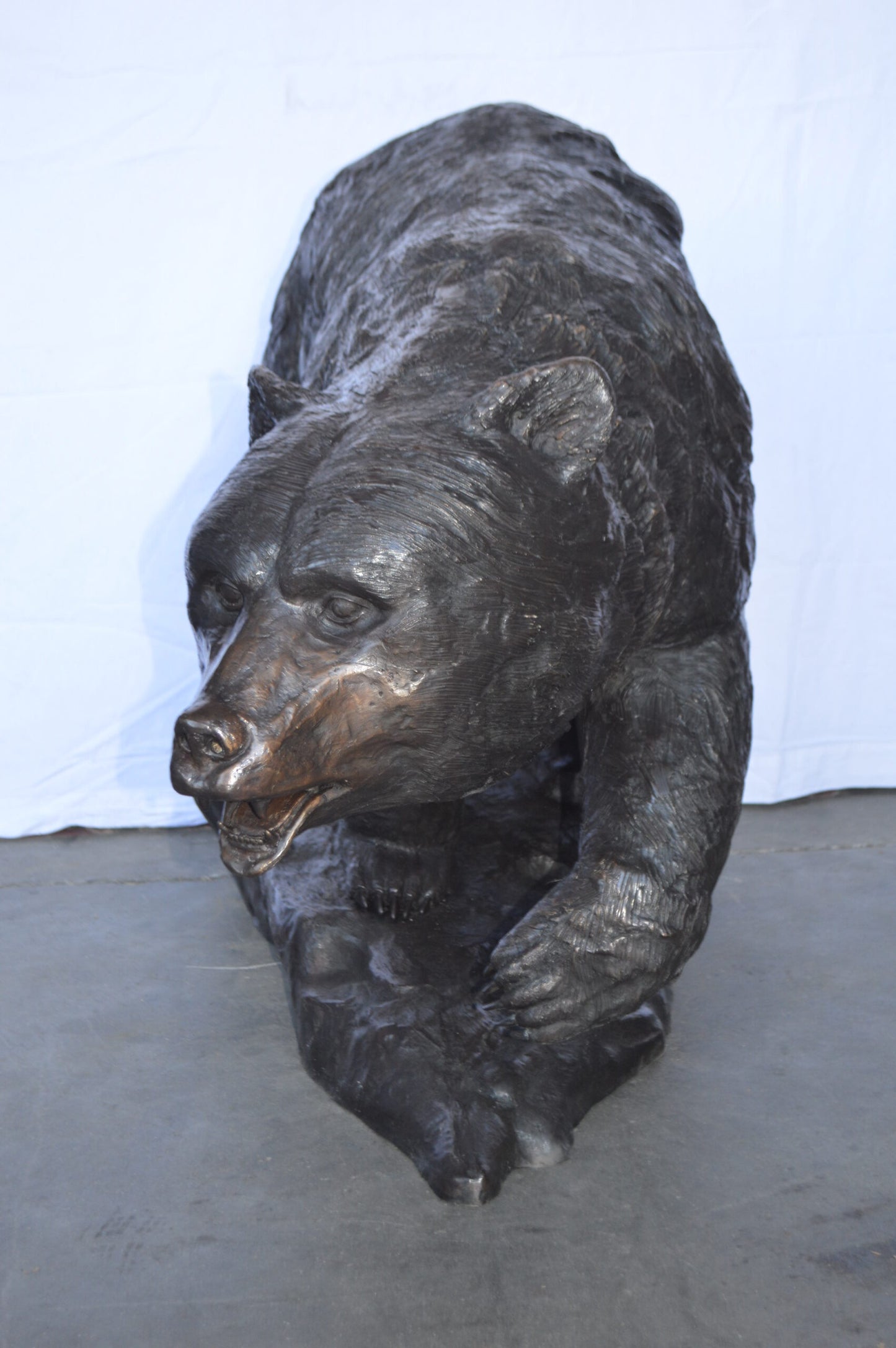 Wild Bear Walking on The Rocks Bronze Statue -  Size: 58"L x 27"W x 40"H.