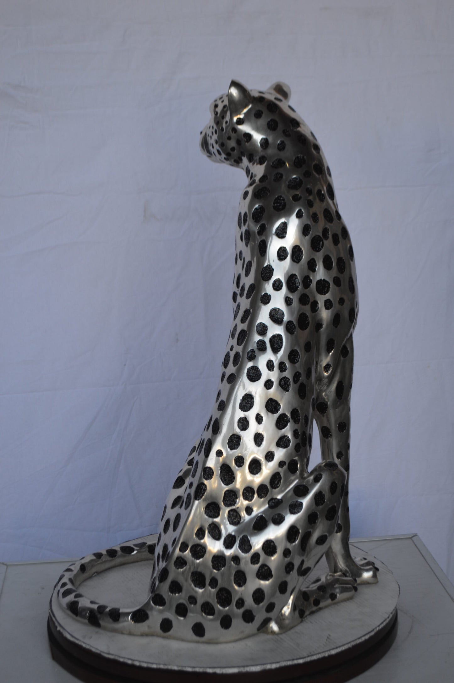 Sitting Cheetah Bronze Statue Silver Finish - Size: 21"L x 21"W x 34"H.