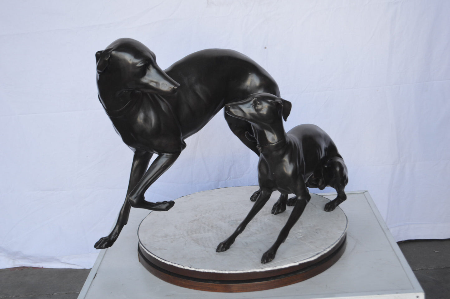 A pair of Whippet Dogs Bronze Statue - Size: 32"L x 17"W x 23"H.
