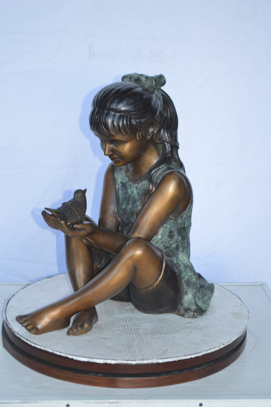 Girl Knees Up Holding a Bird Bronze Statue - Size: 22"L x 14"W x 24"H