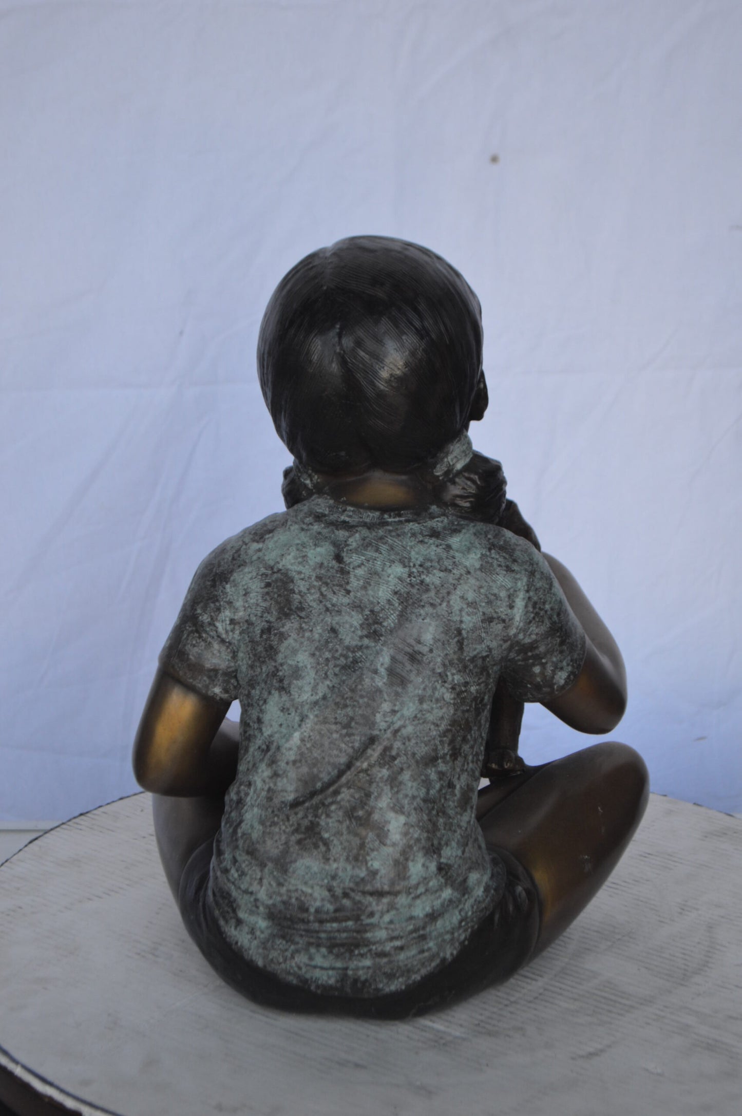 Girl Petting her Dog While Reading Bronze Statue - Size: 13"L x 18"W x 18"H.