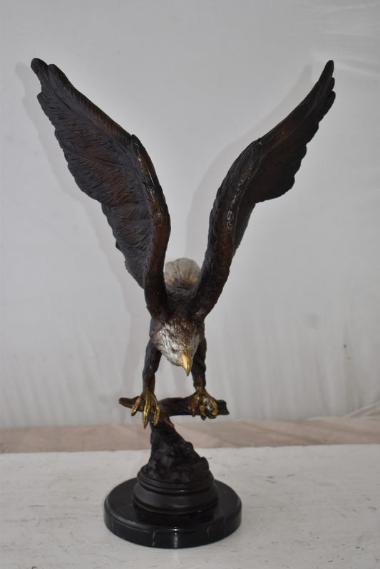 Eagle Holding His Fish Prey Flying Away Bronze Statue Size: 14" x 11" x 23"H