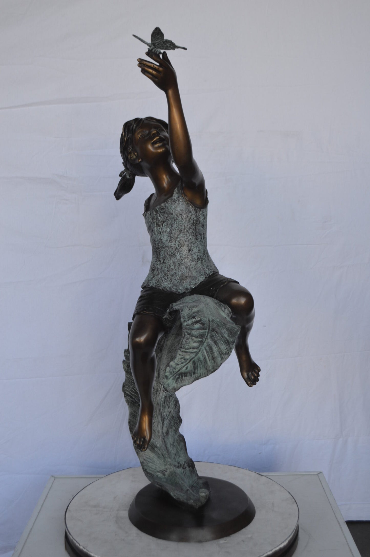 Girl on A Leaf Playing with Butterfly Bronze State - Size: 27"L x 15"W x 45"H.