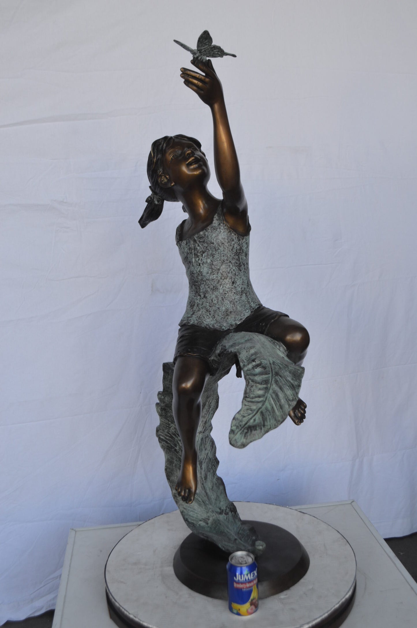 Girl on A Leaf Playing with Butterfly Bronze State - Size: 27"L x 15"W x 45"H.