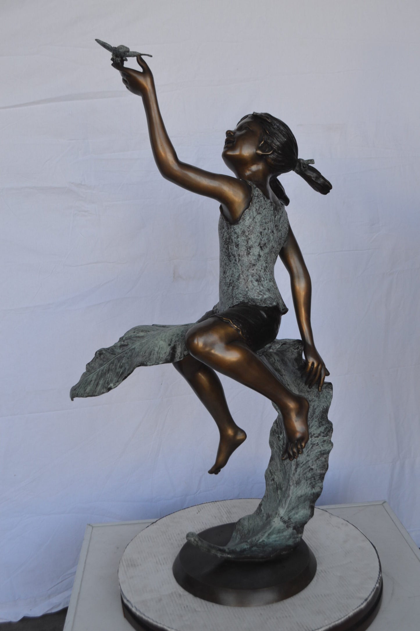 Girl on A Leaf Playing with Butterfly Bronze State - Size: 27"L x 15"W x 45"H.