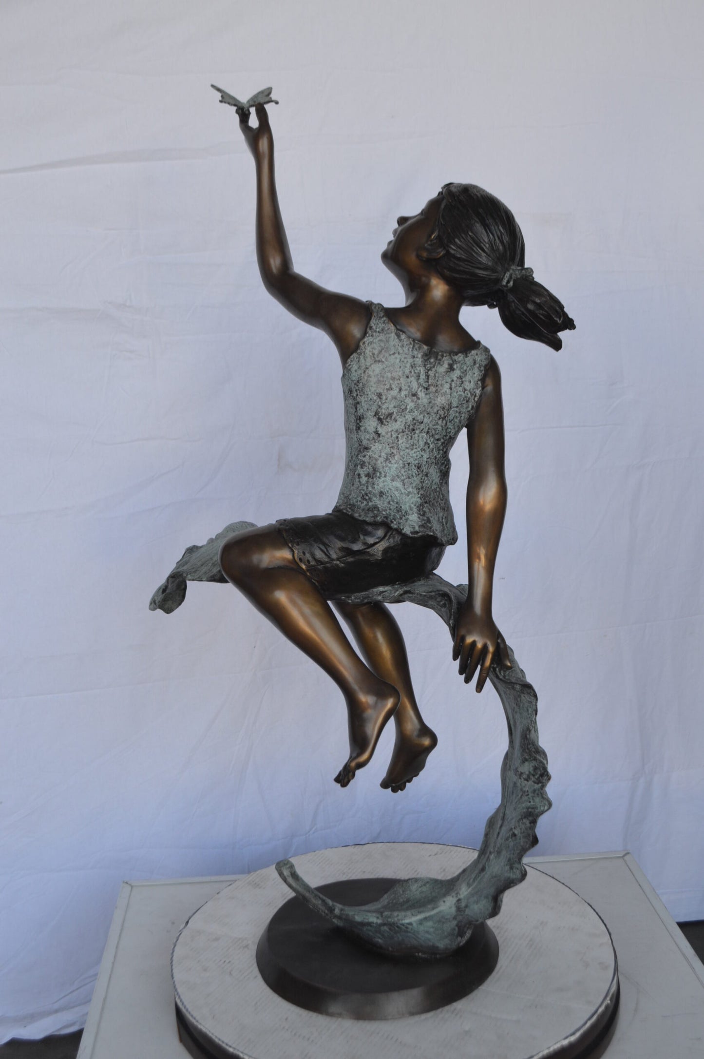 Girl on A Leaf Playing with Butterfly Bronze State - Size: 27"L x 15"W x 45"H.