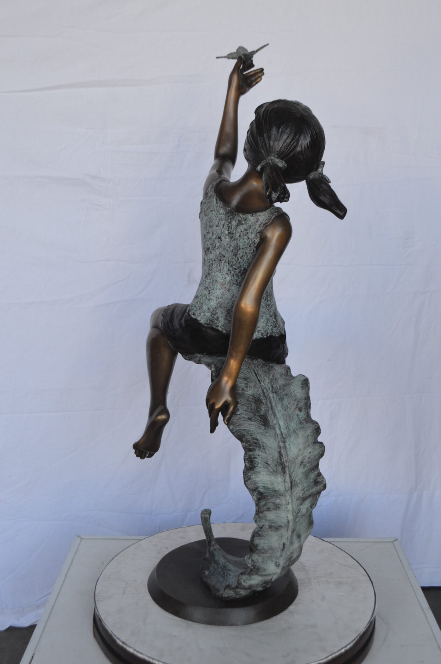 Girl on A Leaf Playing with Butterfly Bronze State - Size: 27"L x 15"W x 45"H.