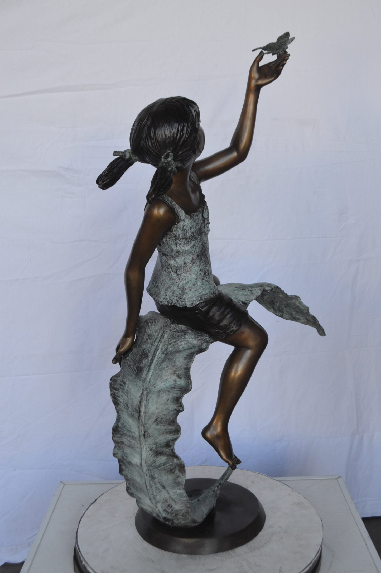 Girl on A Leaf Playing with Butterfly Bronze State - Size: 27"L x 15"W x 45"H.