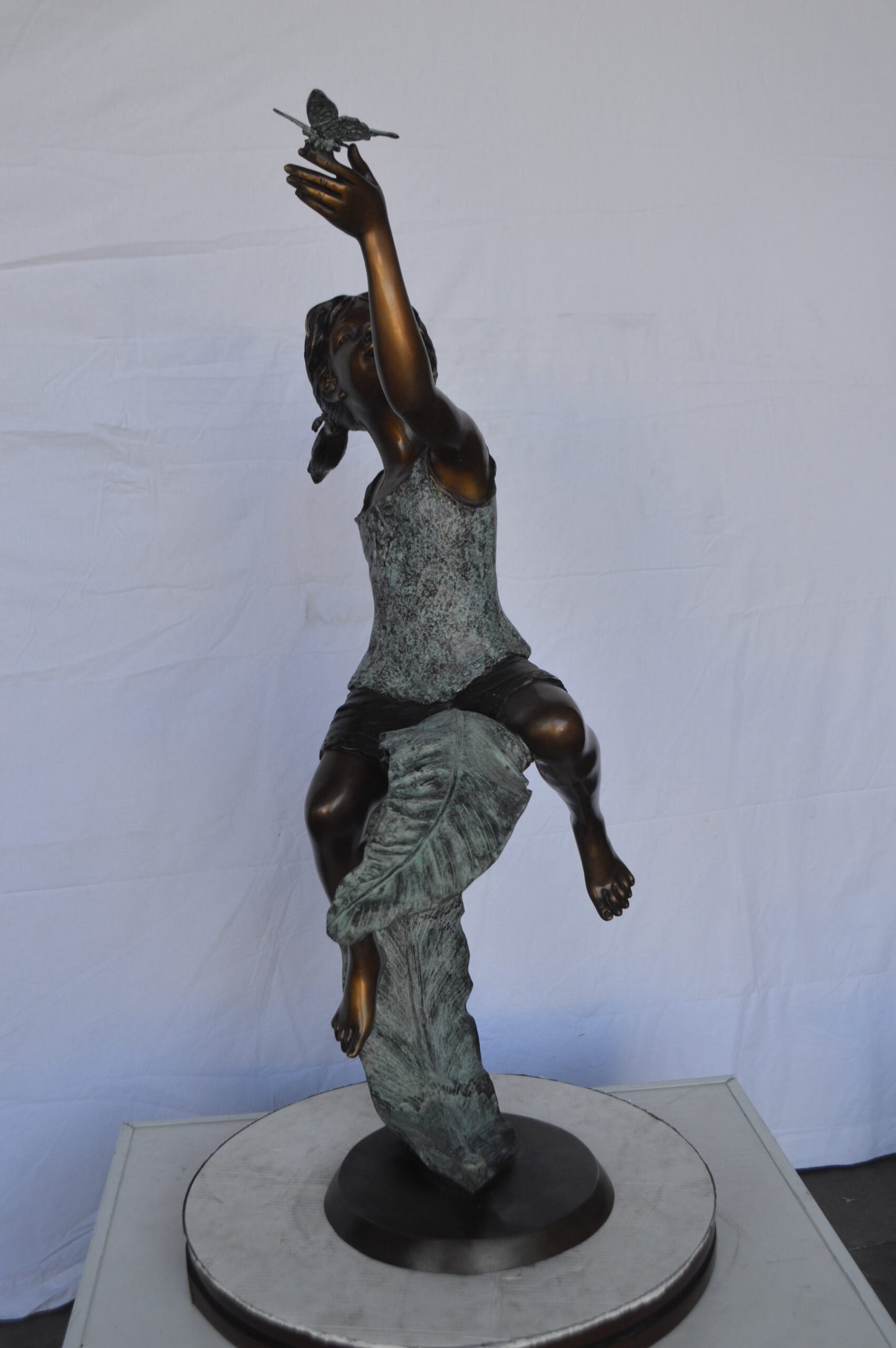 Girl on A Leaf Playing with Butterfly Bronze State - Size: 27"L x 15"W x 45"H.