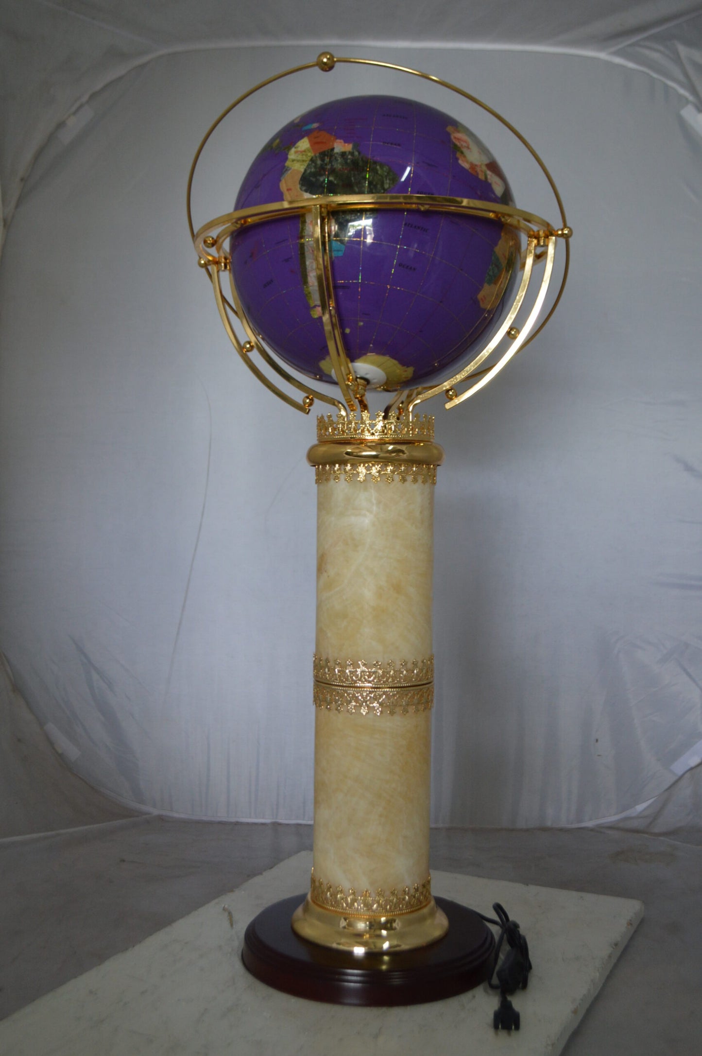 Illuminated Purple World Globe Rotated by motor - Size: 19"L x 19"W x 42"H.