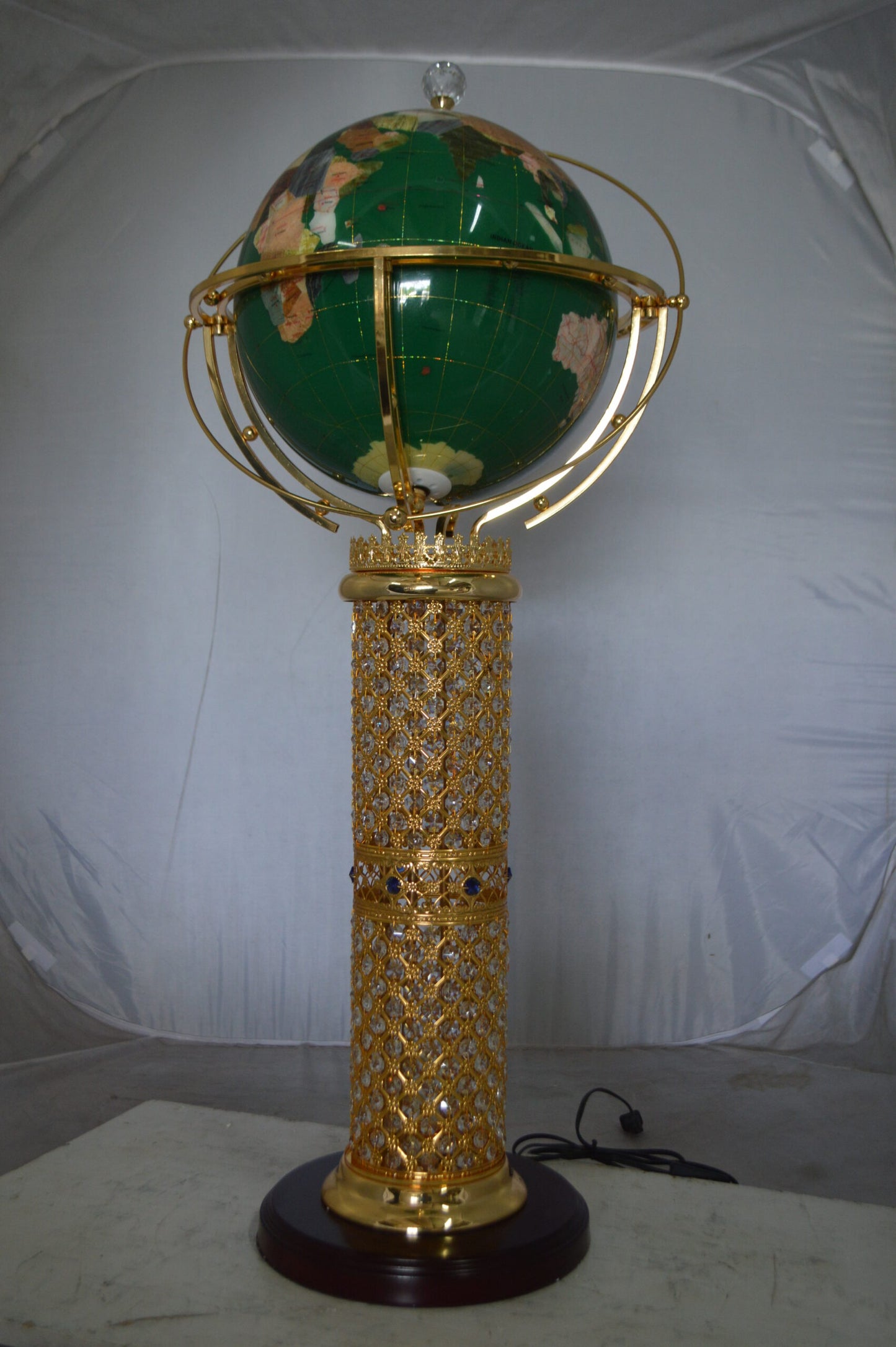 Illuminated Green World Globe Rotated by motor -  Size: 19"L x 19"W x 42"H.