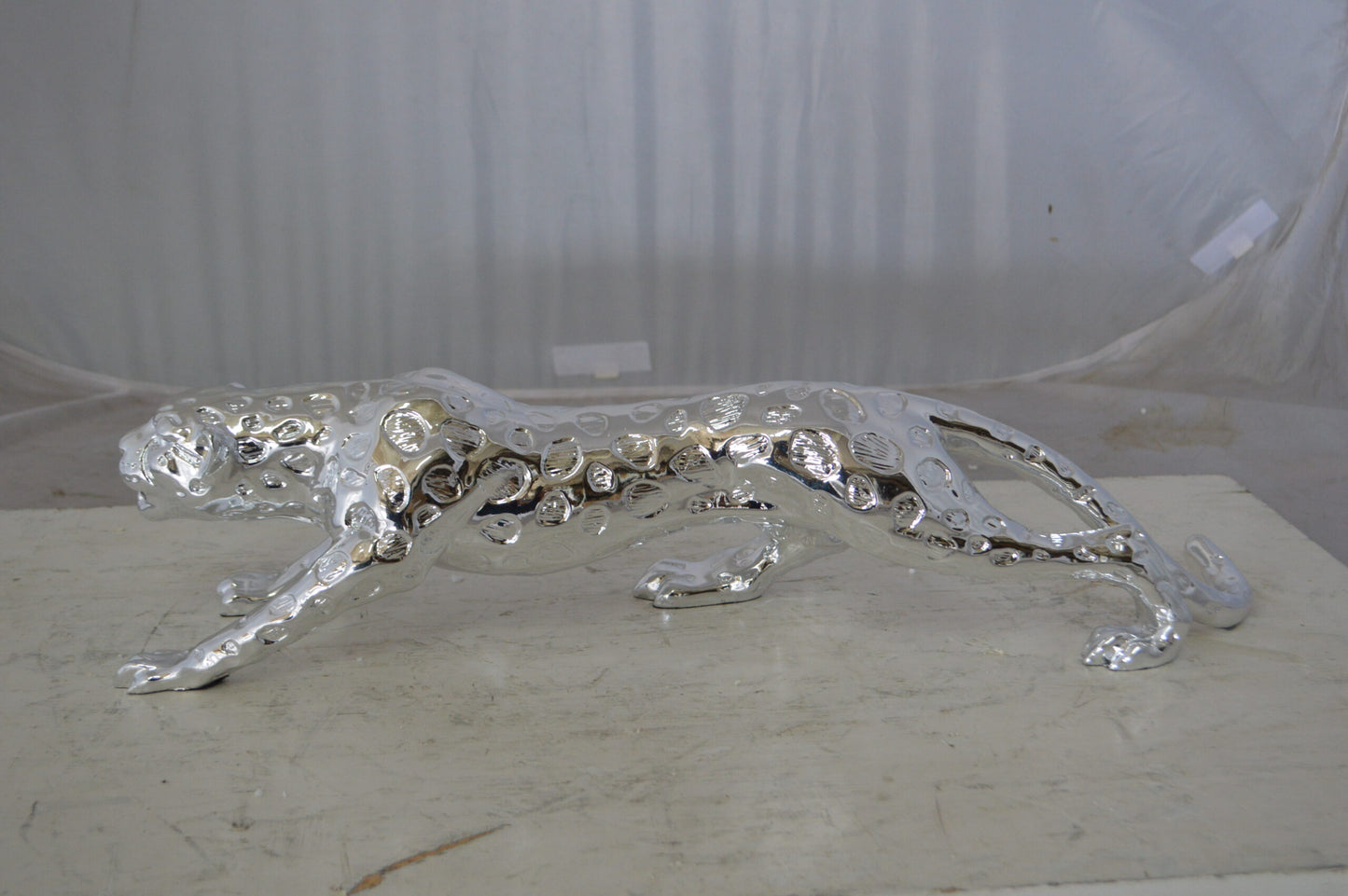 Modern Art Silver Jaguar Statue Made of Resin - Size: 23"L x 6"W x 7"H.