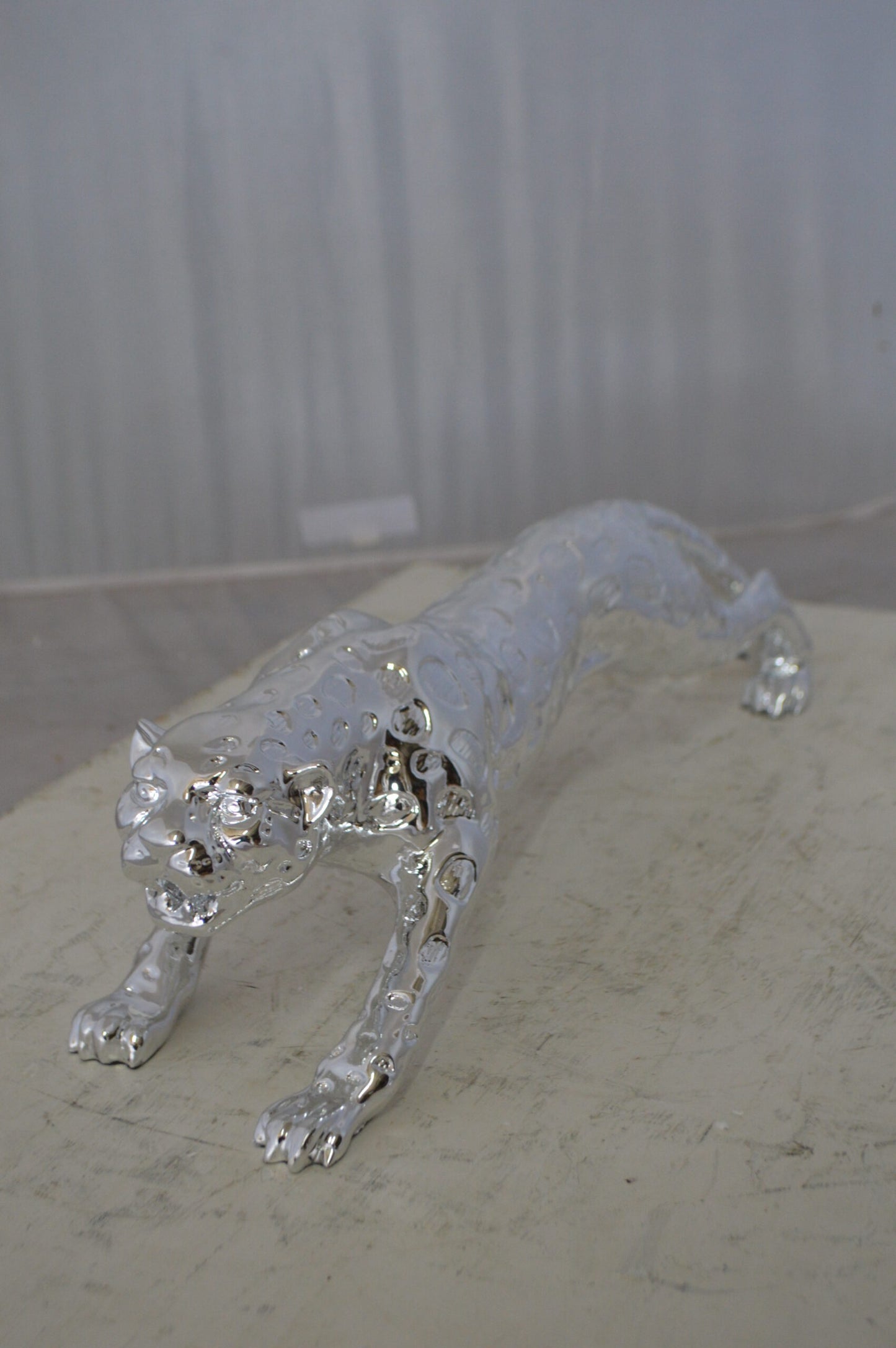 Modern Art Silver Jaguar Statue Made of Resin - Size: 23"L x 6"W x 7"H.
