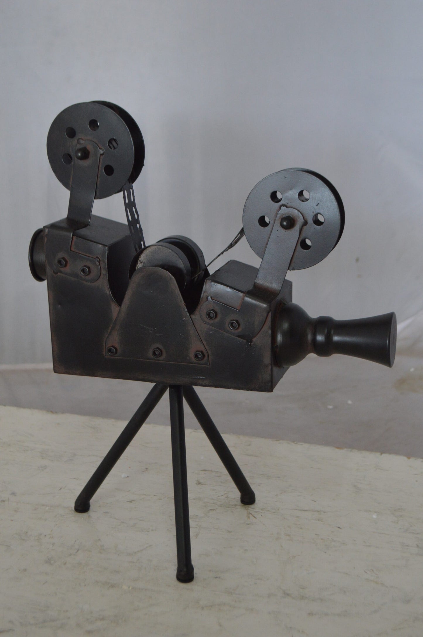 Movie Reel Abstract Metal Statue on tripod - Size: 12"L x 6"W x 15"H.