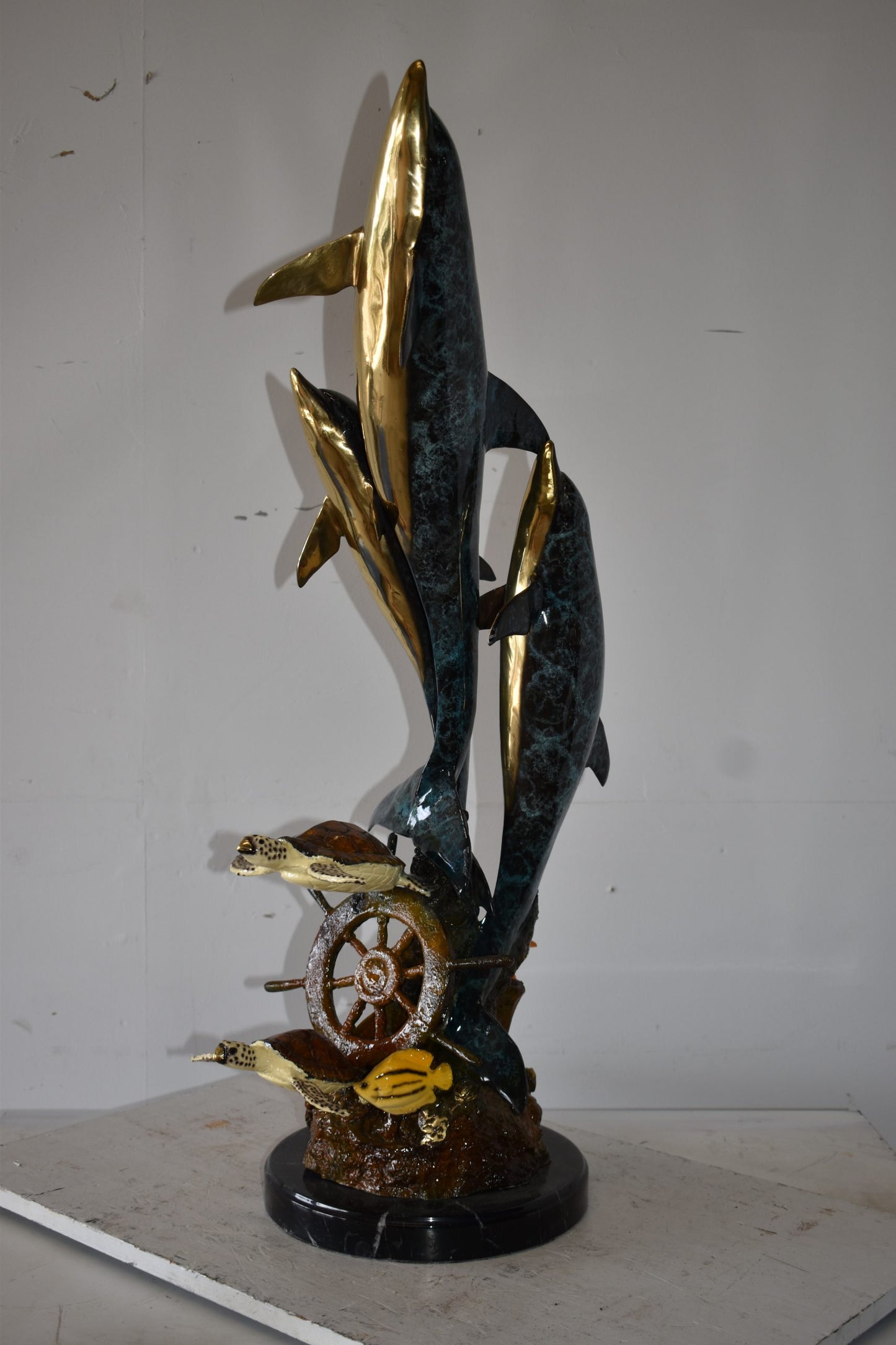 Three Dolphins Turtles and Boat Wheel Bronze Statue Size: 17" x 13" x 40"H