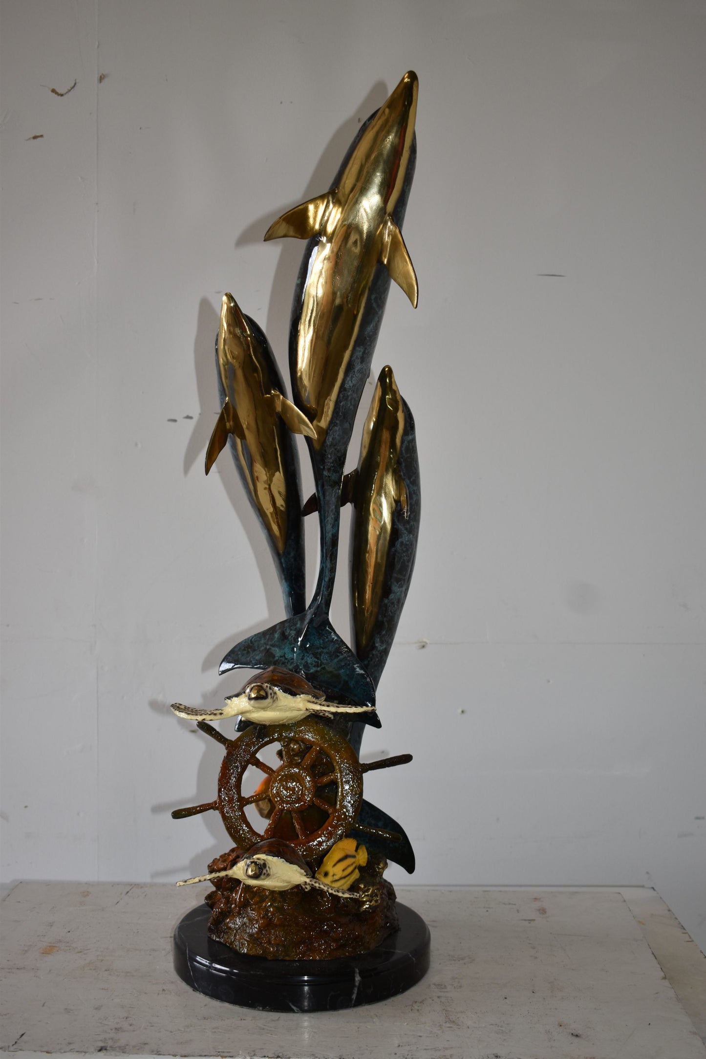 Three Dolphins Turtles and Boat Wheel Bronze Statue Size: 17" x 13" x 40"H