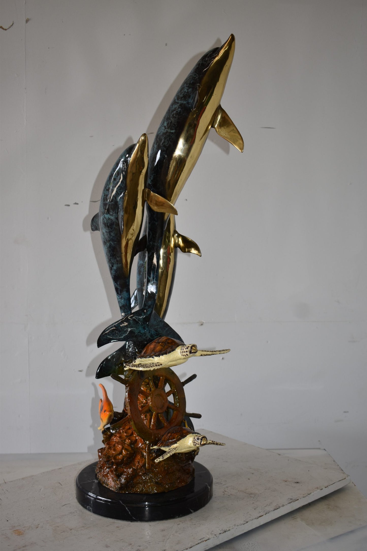 Three Dolphins Turtles and Boat Wheel Bronze Statue Size: 17" x 13" x 40"H