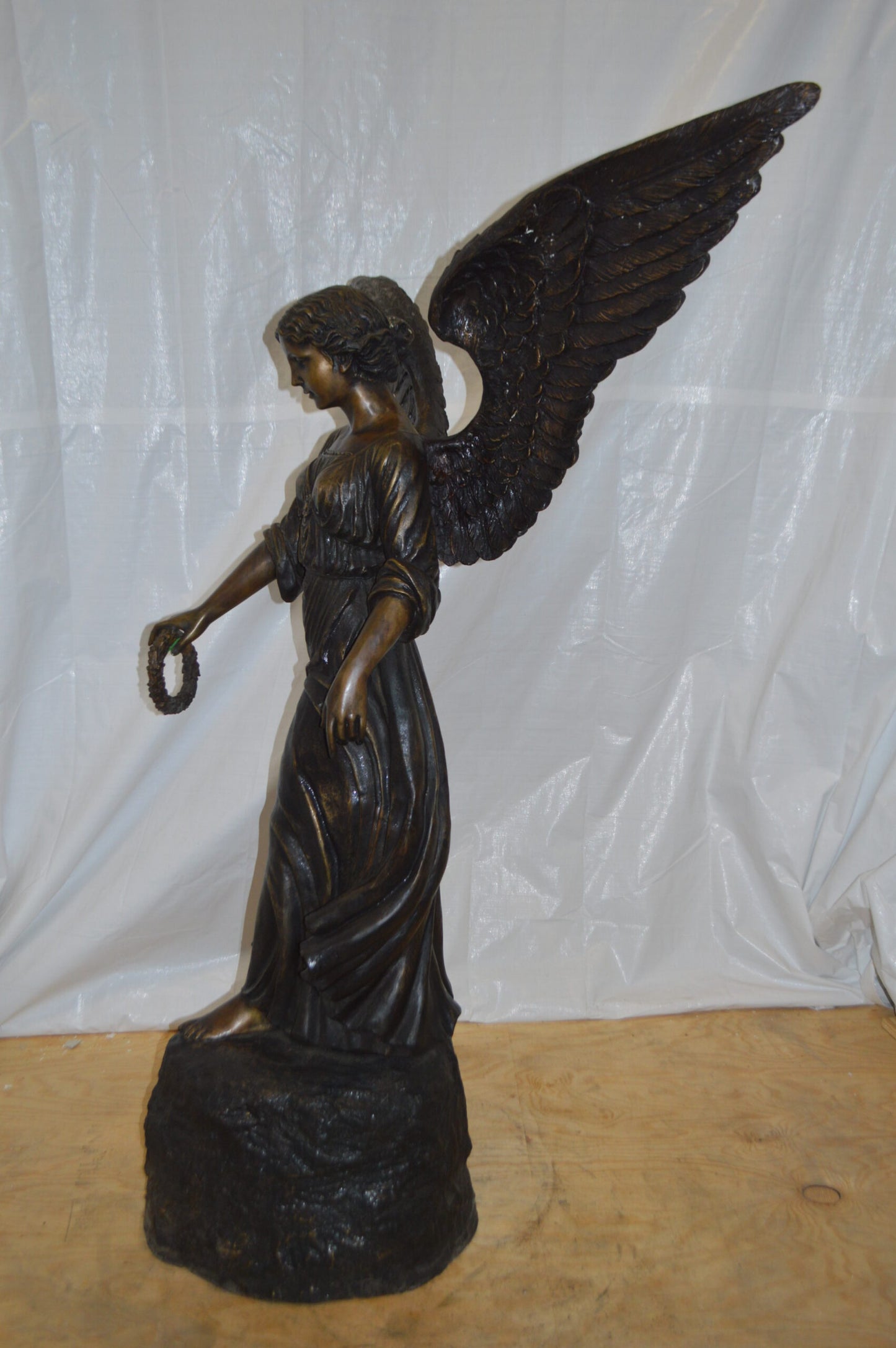 Angel Standing on a Rock Bronze Statue - Size: 60"L x 36"W x 71"H.