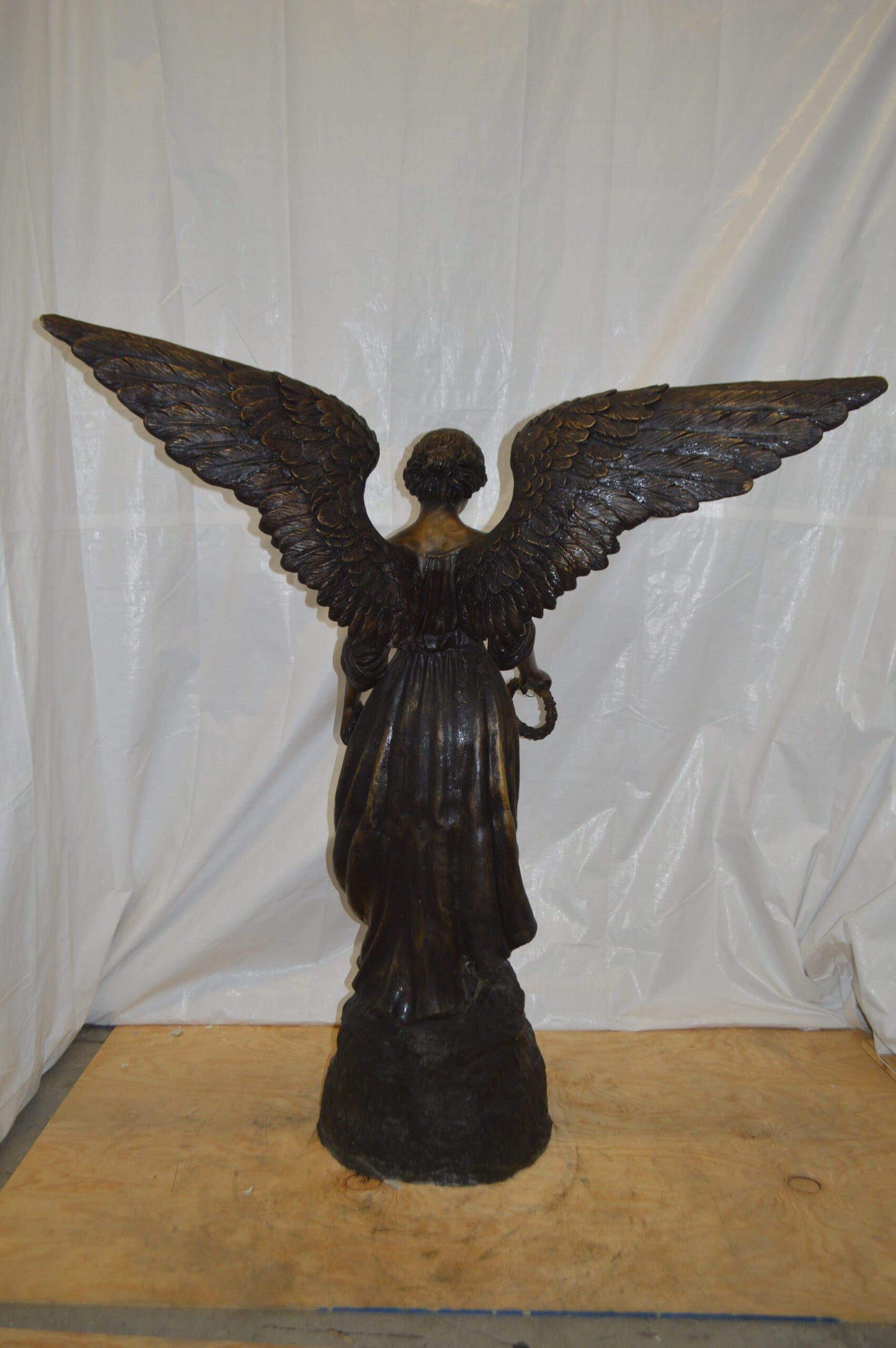 Angel Standing on a Rock Bronze Statue - Size: 60"L x 36"W x 71"H.