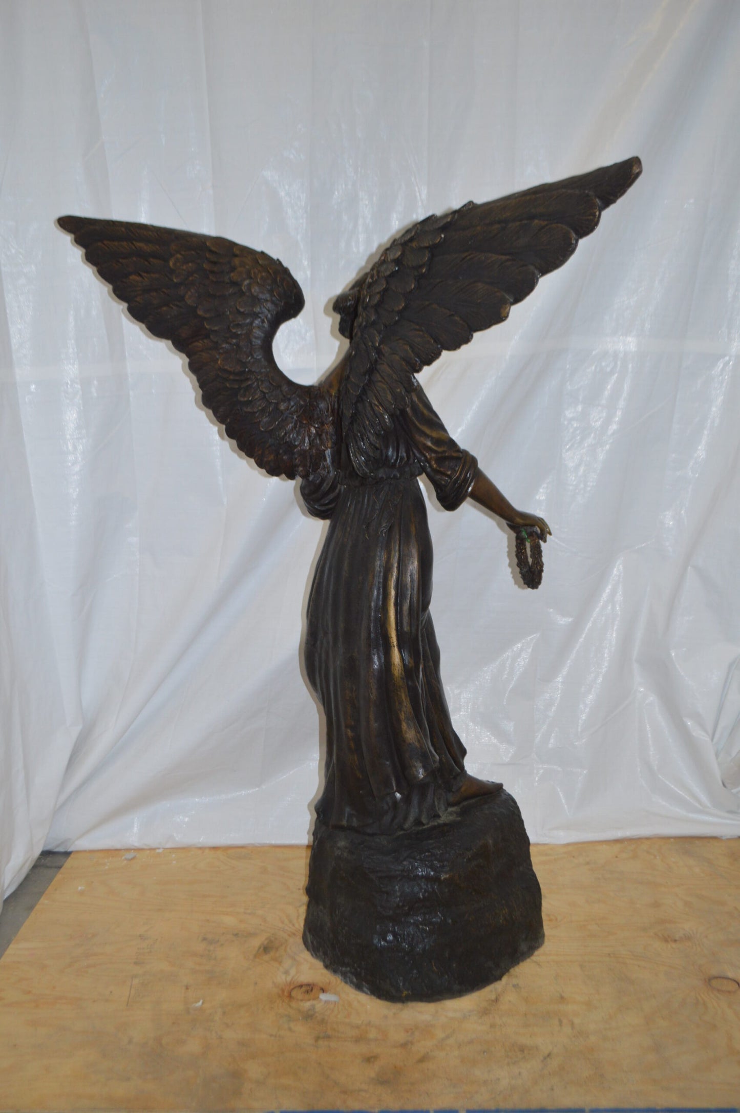 Angel Standing on a Rock Bronze Statue - Size: 60"L x 36"W x 71"H.