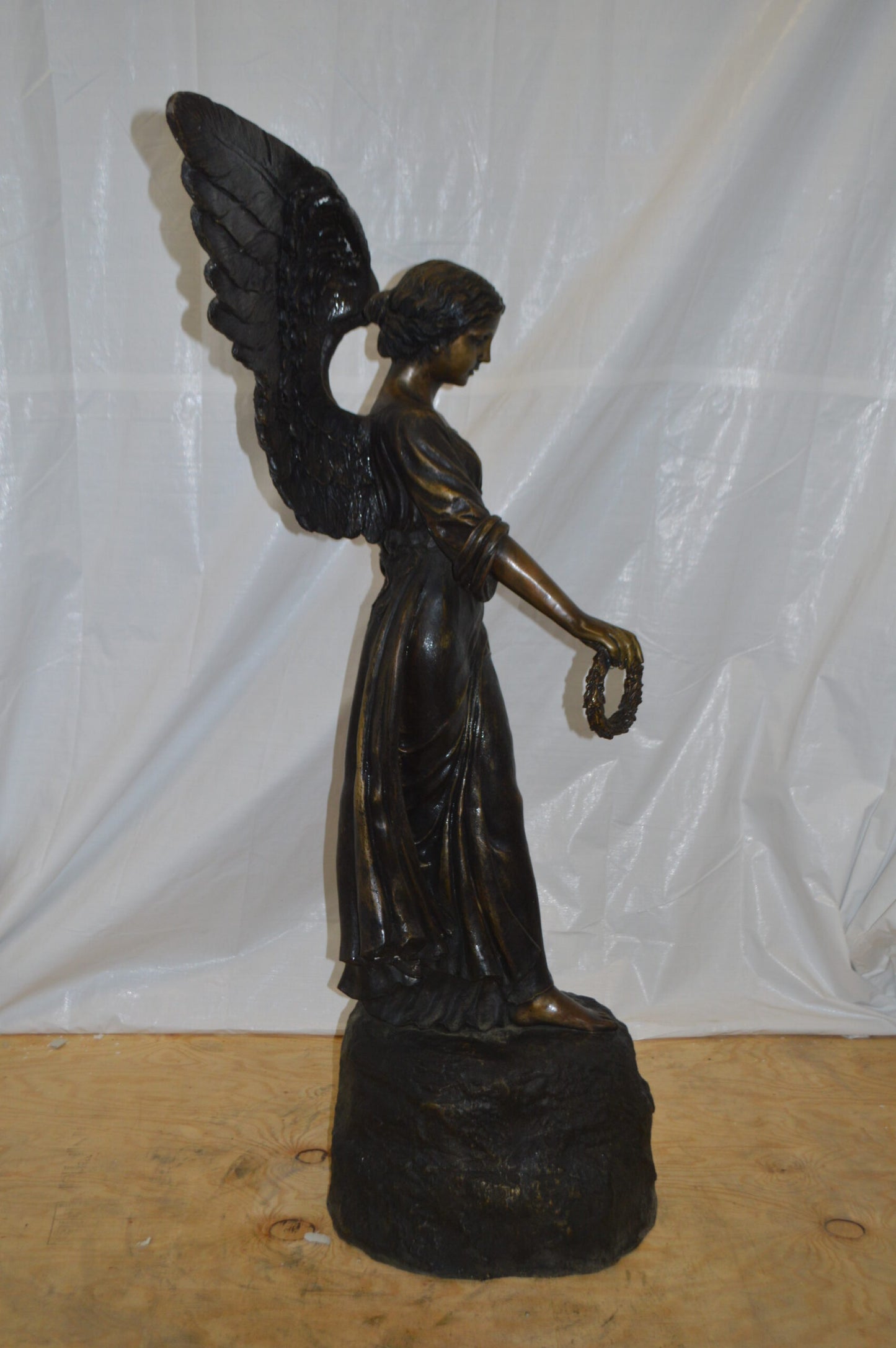 Angel Standing on a Rock Bronze Statue - Size: 60"L x 36"W x 71"H.