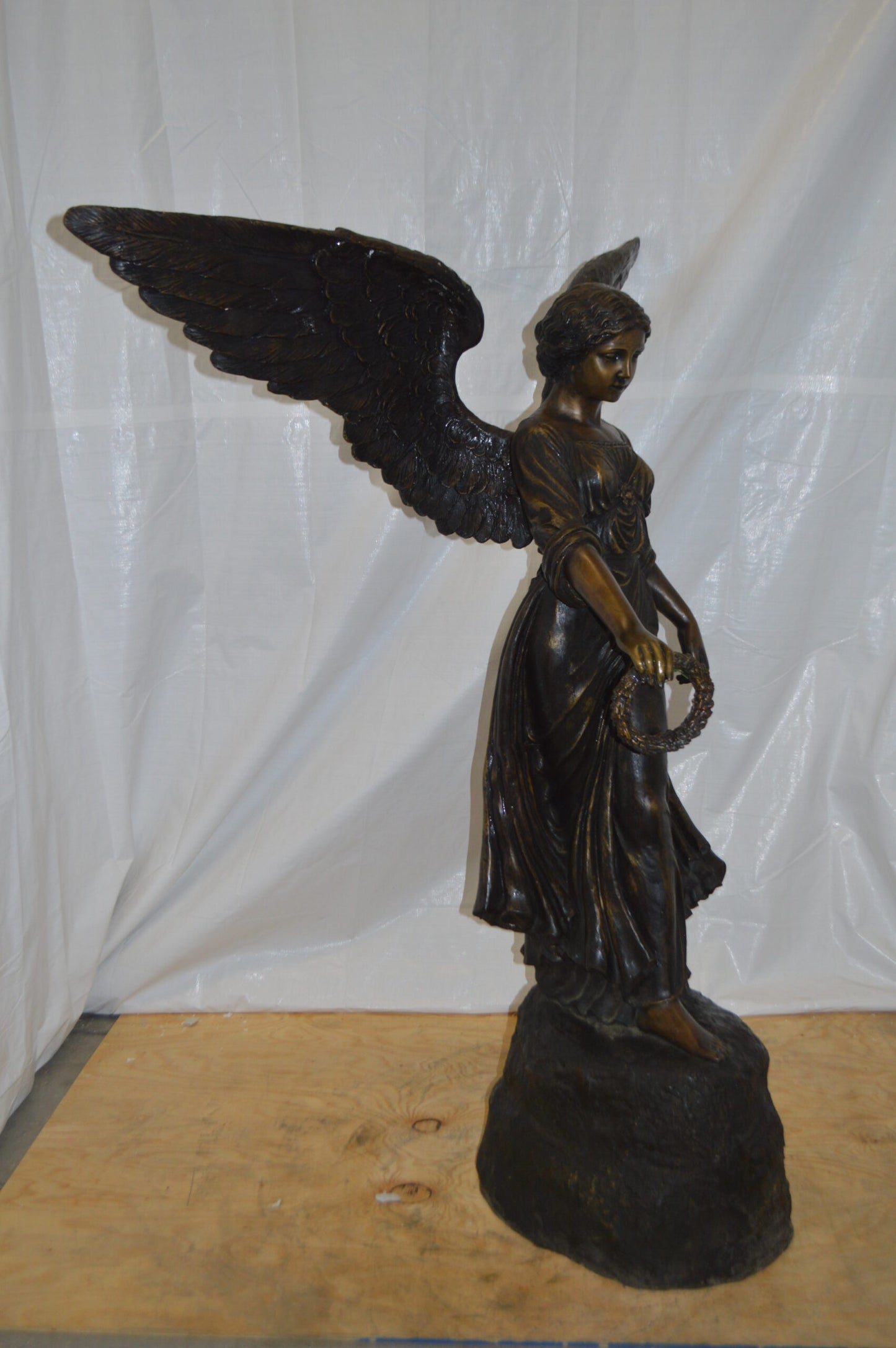 Angel Standing on a Rock Bronze Statue - Size: 60"L x 36"W x 71"H.