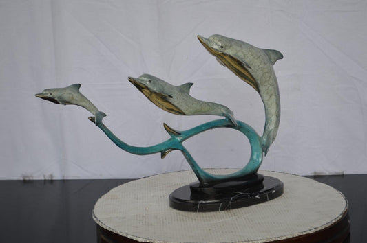 Three dolphins swimming bronze state -  Size: 26"L x 7"W x 16"H.