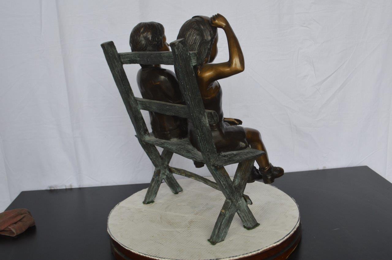 Two Kids Sitting On a Bench Bronze Statue - Size: 20"L x 18"W x 24"H.