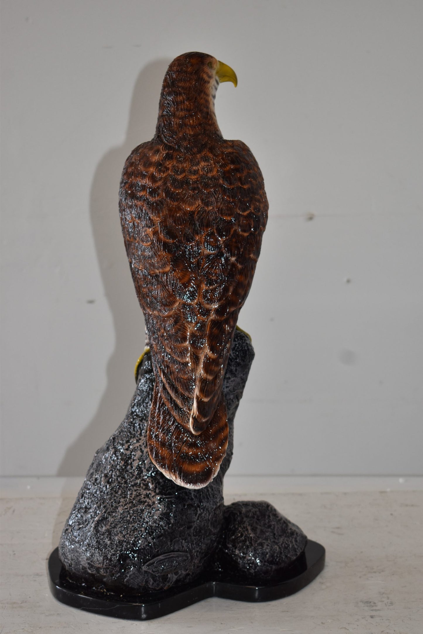 Eagle Standing on a Rock Looking for Prey Size: 10" x 13" x 22"H