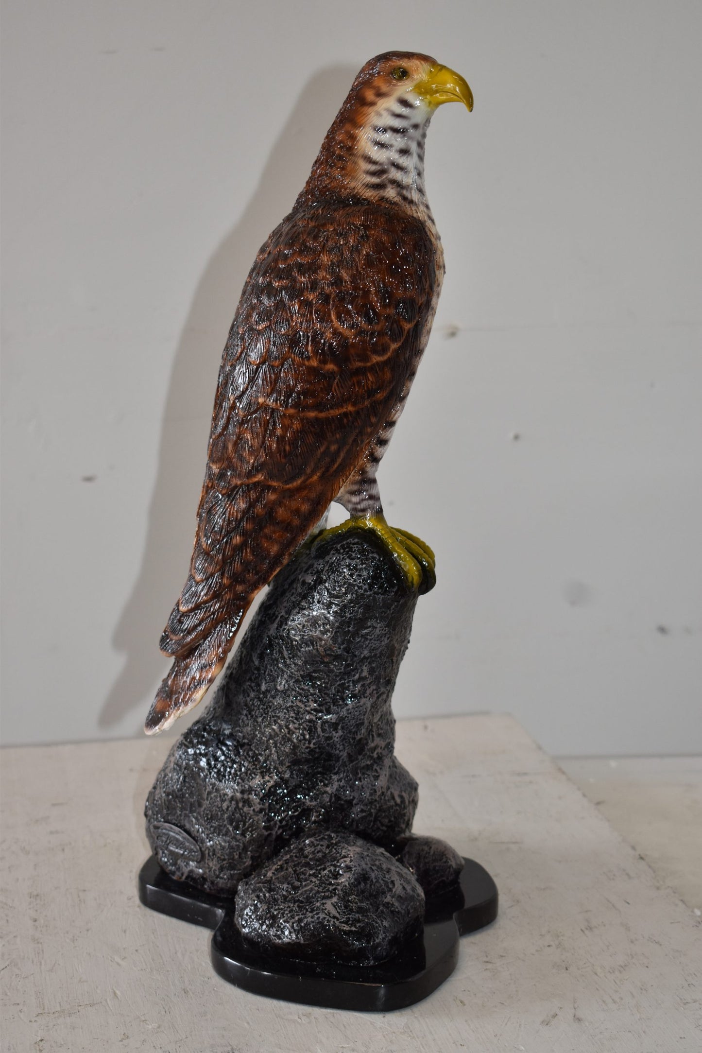 Eagle Standing on a Rock Looking for Prey Size: 10" x 13" x 22"H
