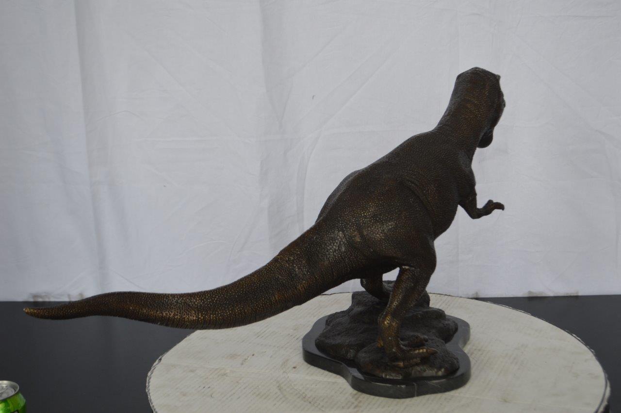 Tyrannosaurus Rex Dinosaur Bronze Statue -  Size: 31"L x 12"W x 15"H.