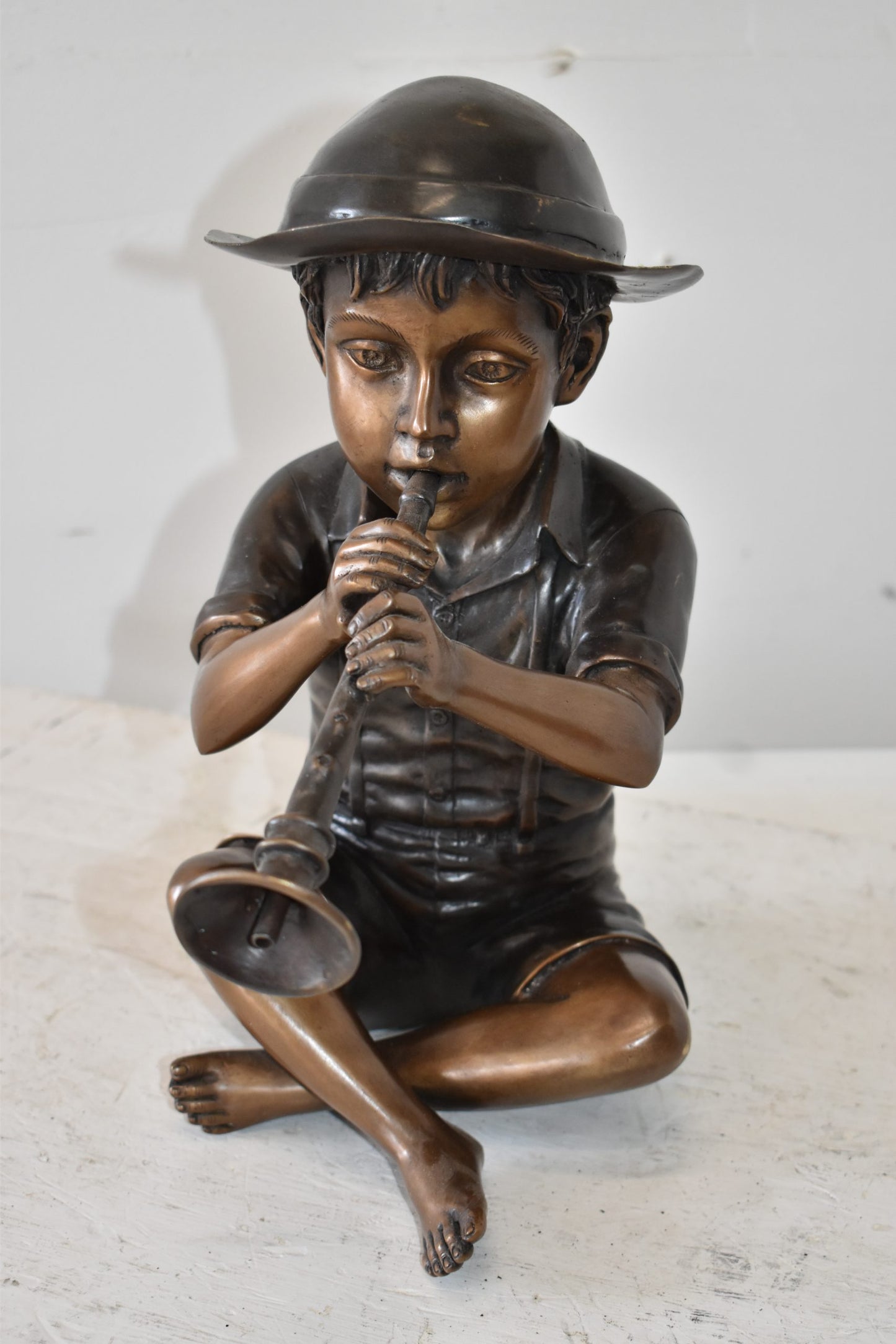 A little Boy Playing his Flute Bronze Fountain Size: 13" x 8" x 15"H