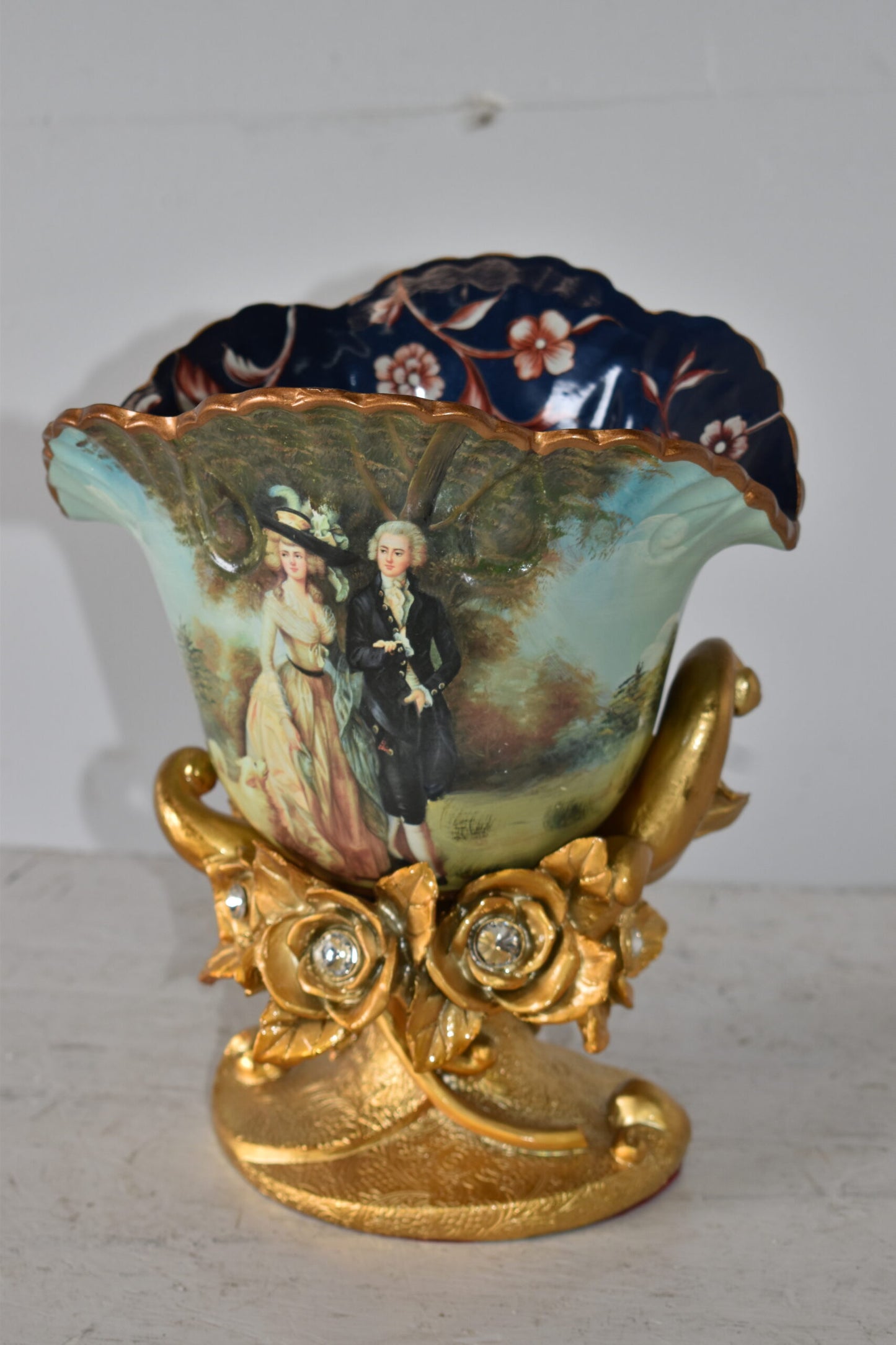 Blossoming Resin Vase with Mr. William Hallett Design Size: 9" x 8" x 12"H