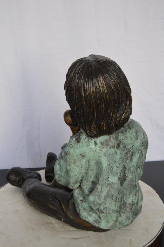 Young Child With an Old Telephone Bronze Statue - Size: 21"L x 14"W x 19"H.