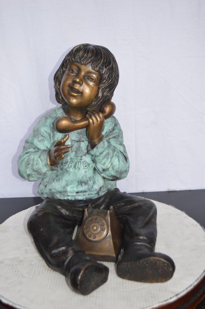 Young Child With an Old Telephone Bronze Statue - Size: 21"L x 14"W x 19"H.