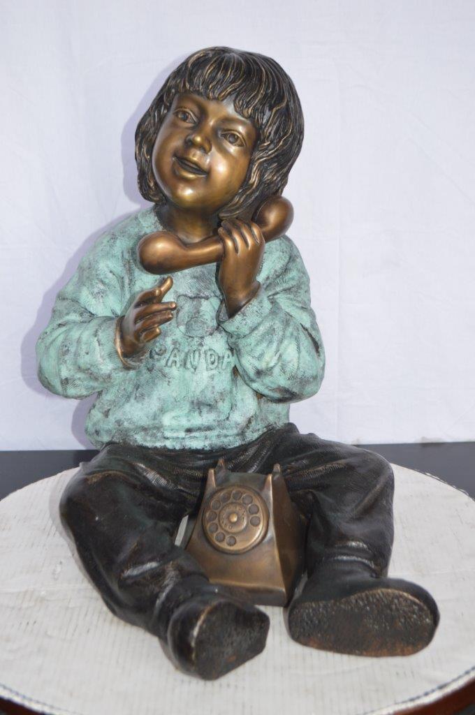 Young Child With an Old Telephone Bronze Statue - Size: 21"L x 14"W x 19"H.