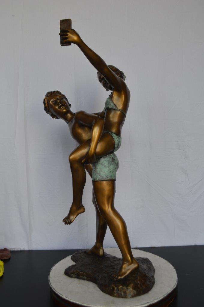 Kids Taking a Selfie W a Smartphone Bronze Statue - Size: 23"L x 20"W x 43"H.