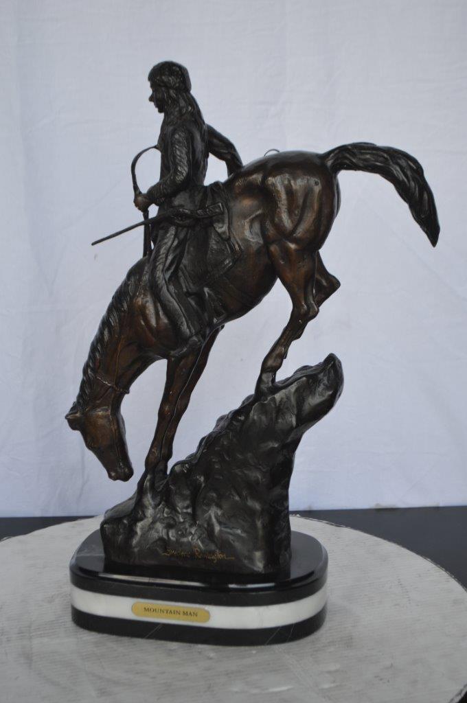 Mountain Man replica by Frederic Remington - Size: 6"L x 14"W x 22"H.